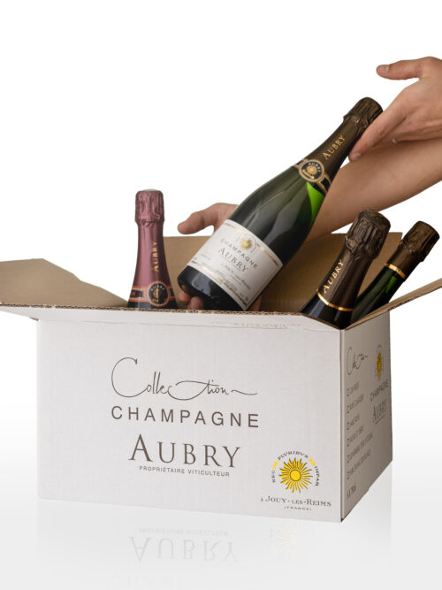 Une photo des bouteilles qui composent la gamme des champagnes Aubry